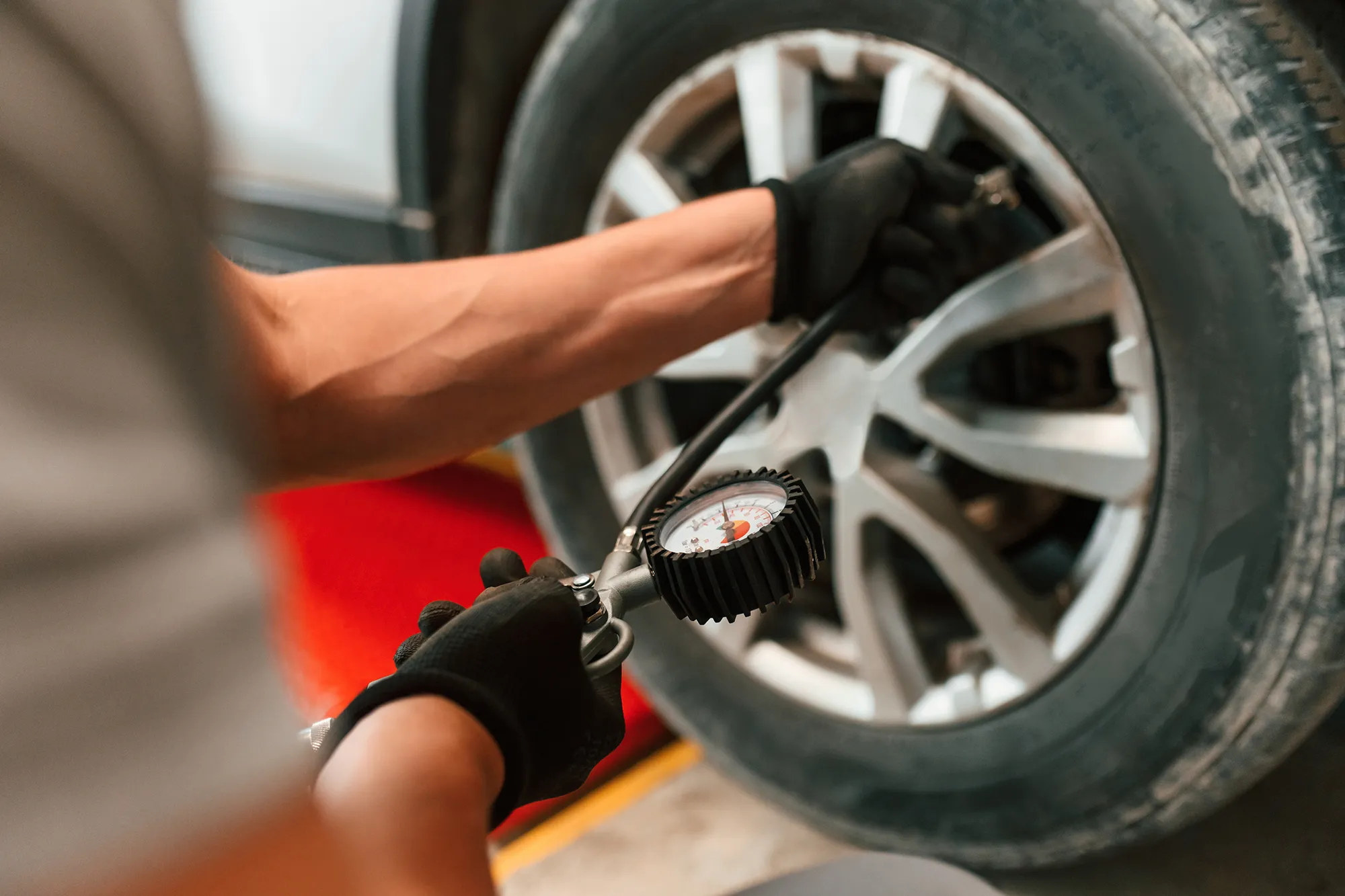 Technician checking tyre pressure at Royal Automotive in Epping